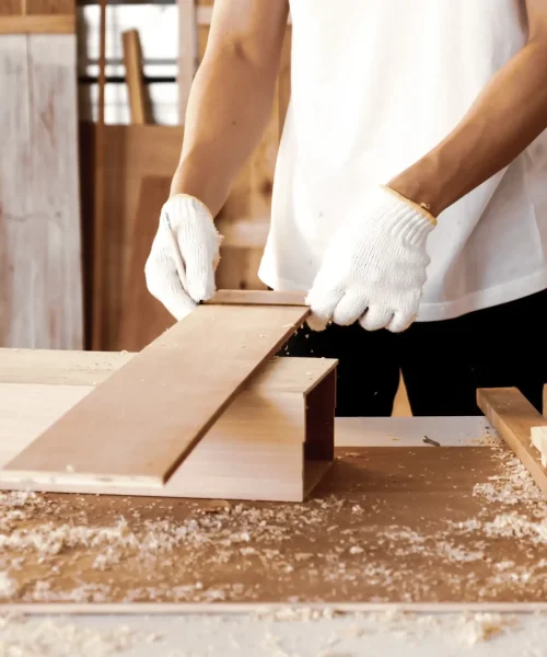 carpenter-holding-pieces-of-board-at-site-2026-01-08-05-47-49-utc